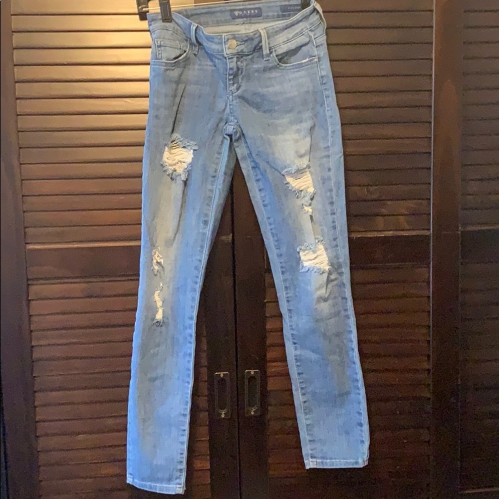 Guess light-wash skinny jeans with rips.